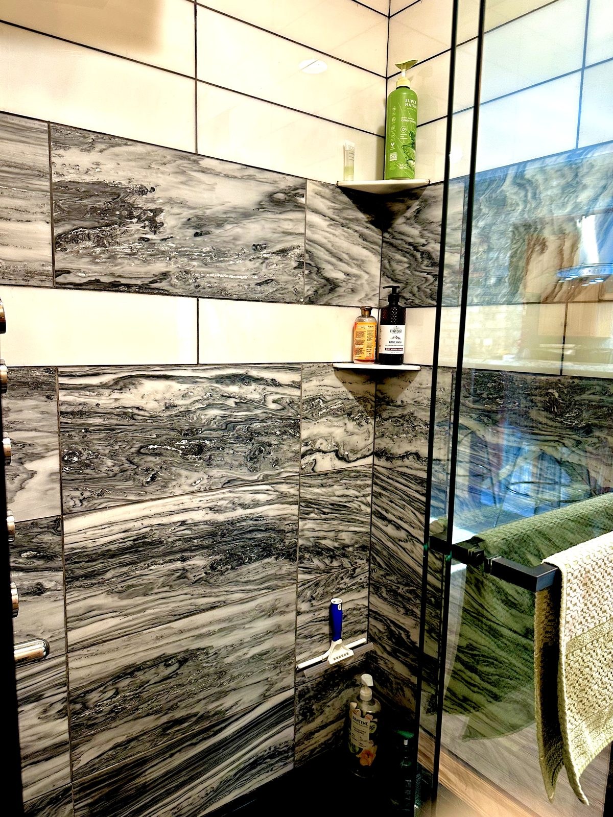 Second bathroom walk-in shower with patterned tile