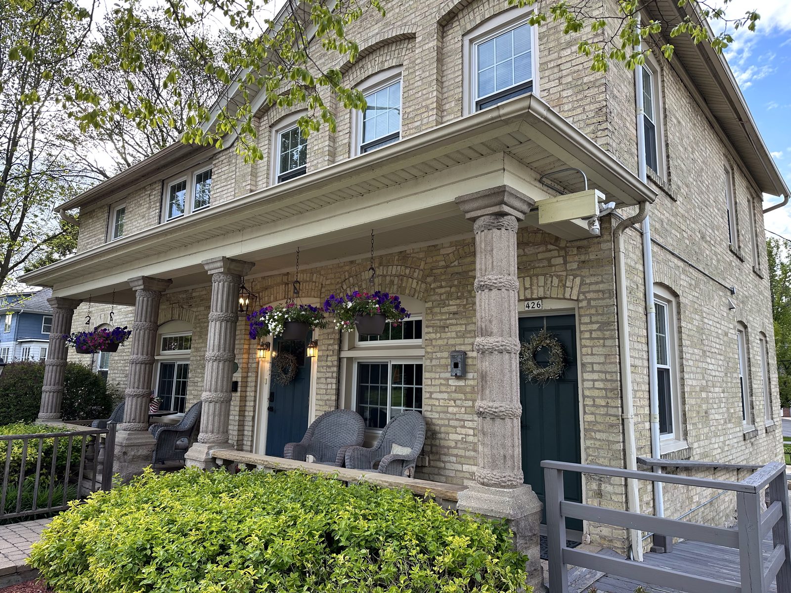 Front of the Cream City Brick house in summer