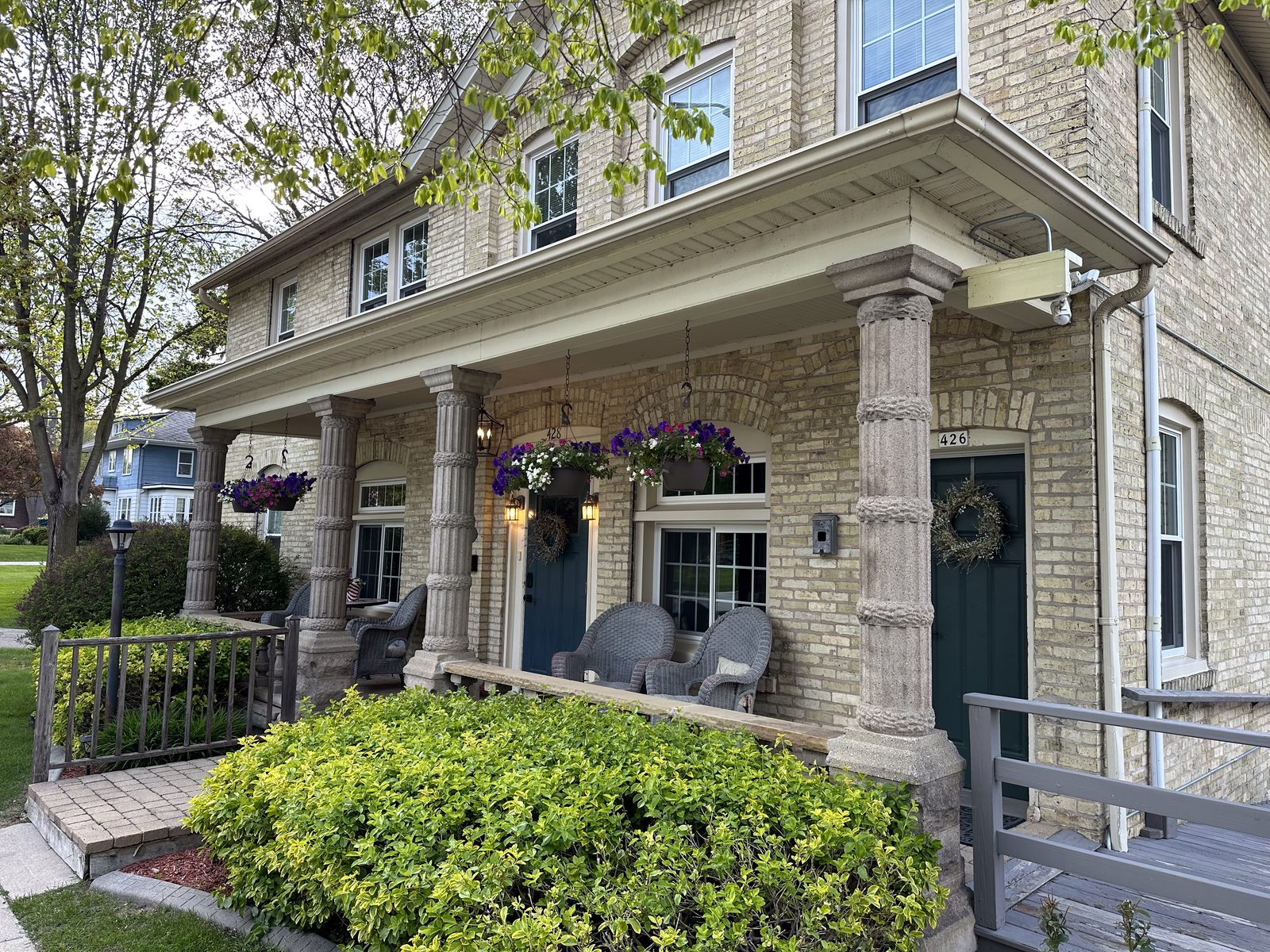 Wide view of the Cream City Brick house and front porch