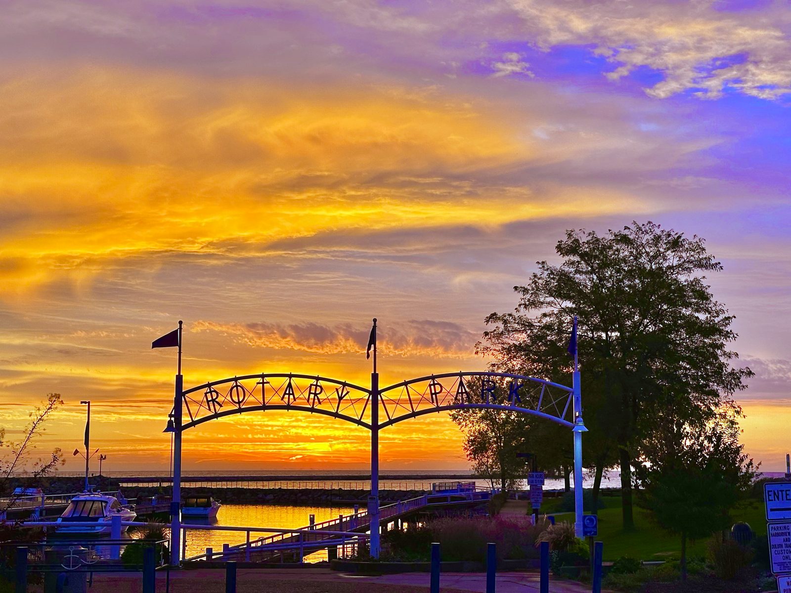 Rotary Park harbor entrance sign at sunset