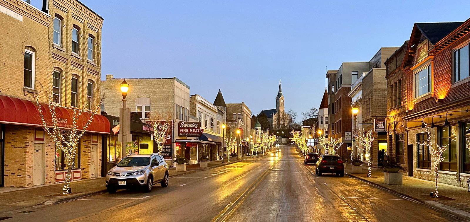 Downtown Port Washington street lit in the evening