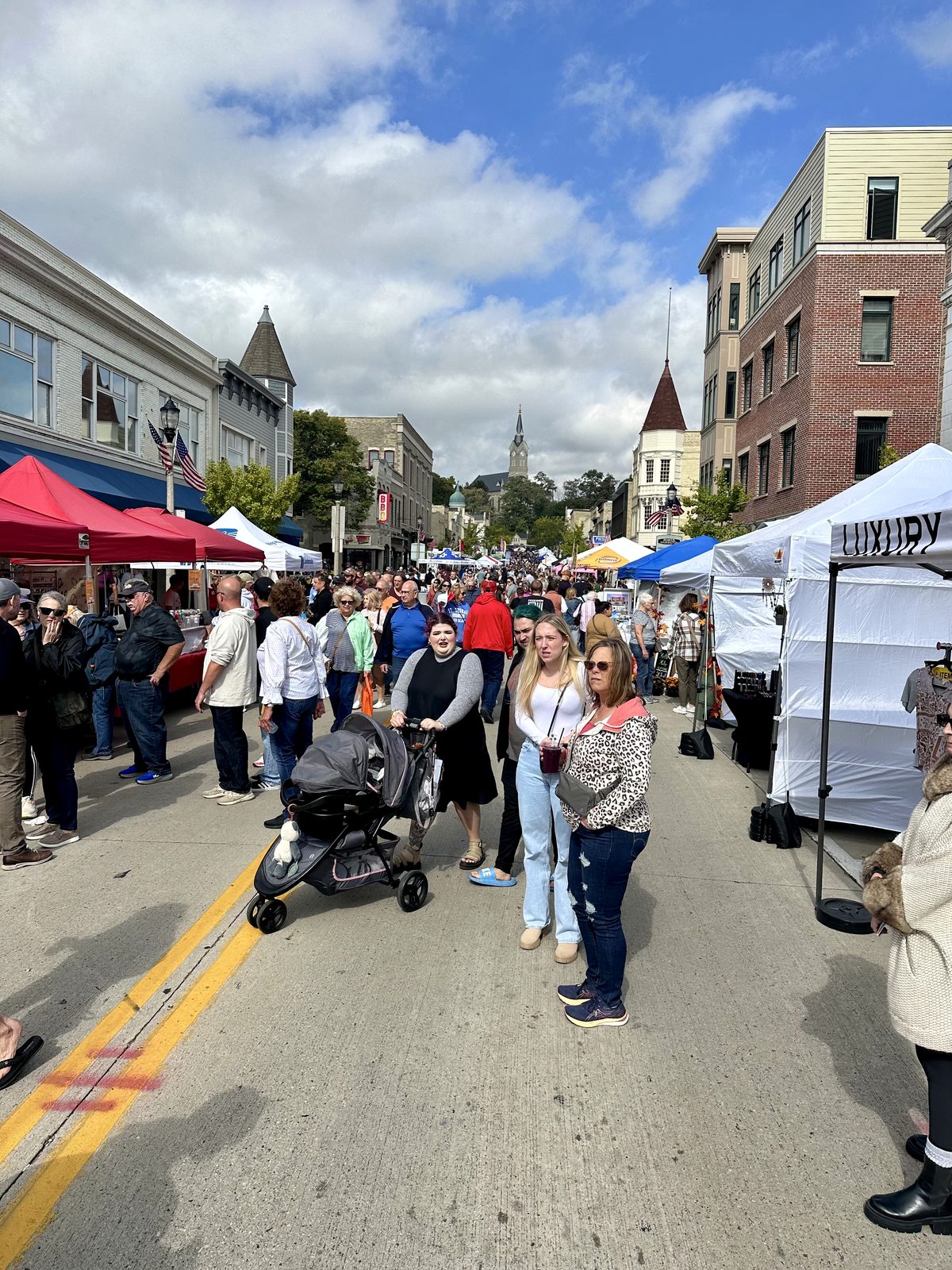 Downtown Port Washington street festival with vendor tents