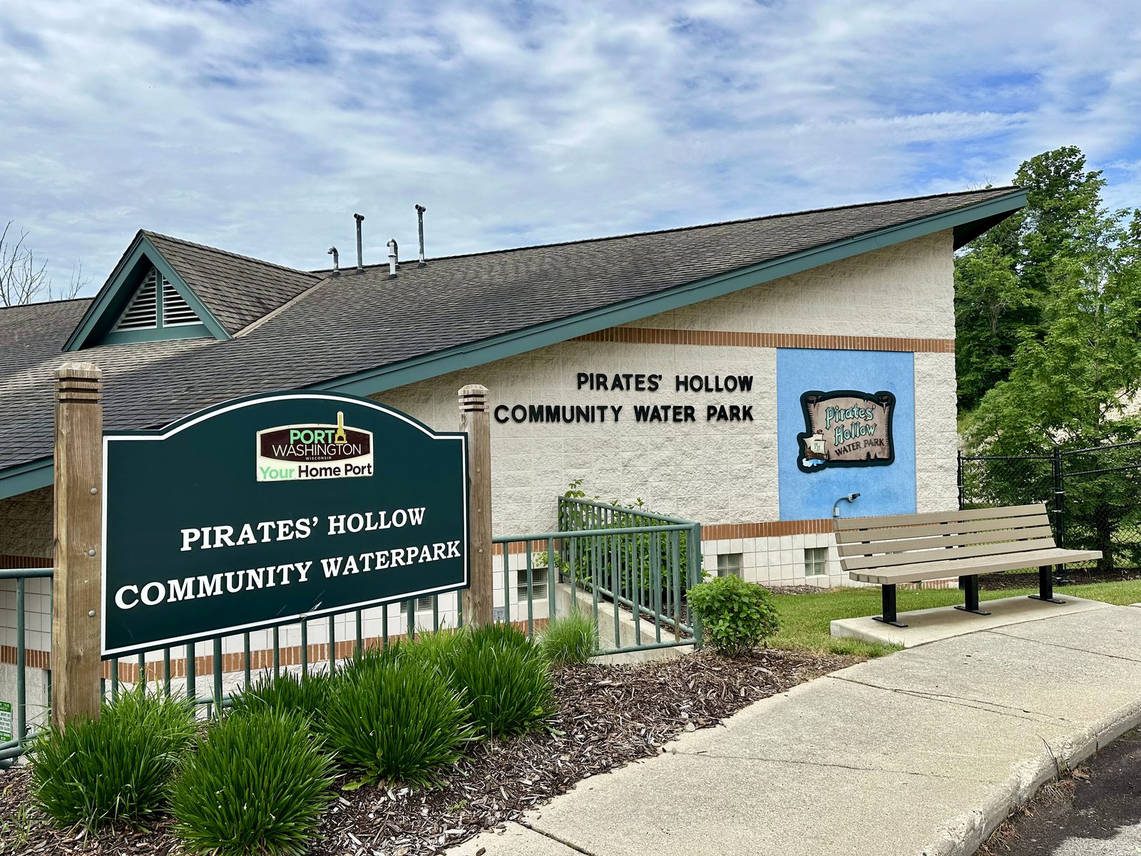 Pirates' Hollow Community Waterpark building and sign